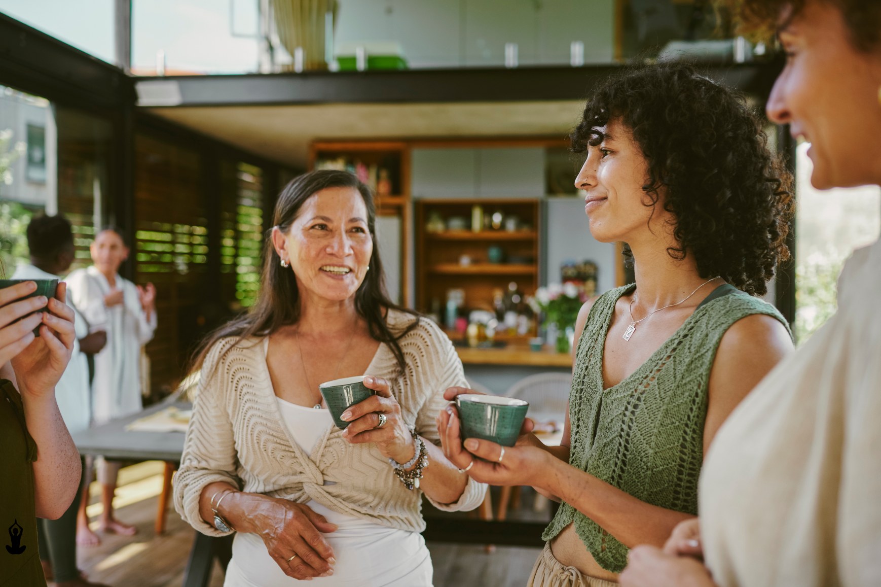 Women chatting over tea at a Viva Core community gathering