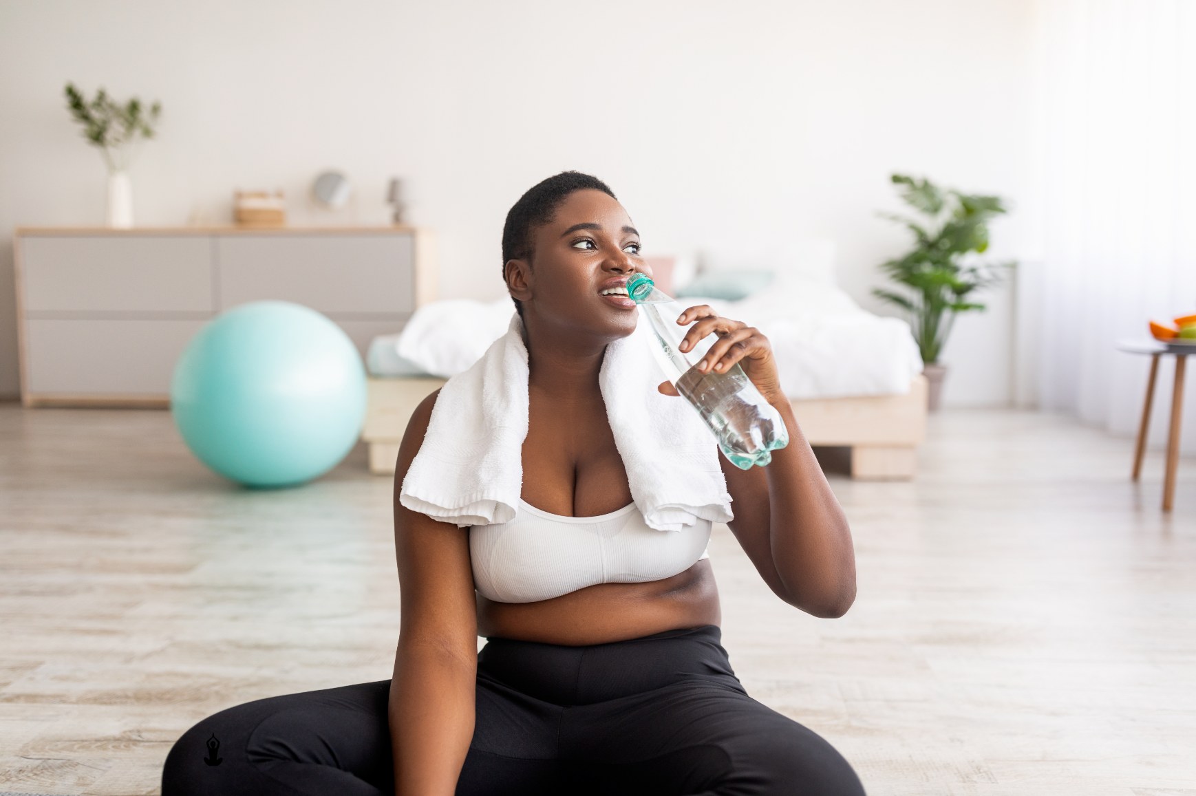 Woman resting with water after exercise
